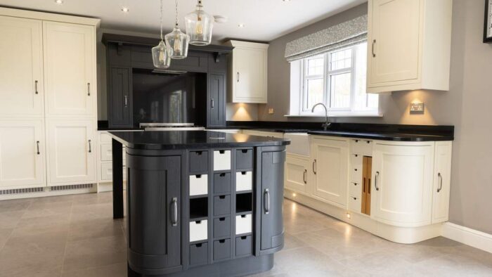 Laura Ashley Buttercream Wooden Dovetail Joint Symphony Kitchen with Graphite Grey Island and Utility Room – AEG Smeg Appliances – Black Granite Worktops