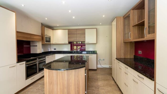 Leicht Large Buttercream and Wood Effect Kitchen with Island and Utility Room – Neff Liebherr Appliances – Black Granite Worktops