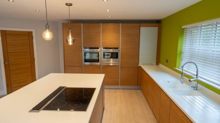 Luxury Poggenpohl Beech Wood Handleless Kitchen and Matching Island – Neff Appliances – Corian Worktops