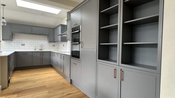 Modern Graphite Grey Coppertone Handled Kitchen with Peninsula – Neff AEG Bosch Appliances – White Quartz Worktops