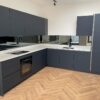 New Installed Unused Pronorm Navy Blue Handleless Kitchen – Bosch Appliances – White Corian Worktops