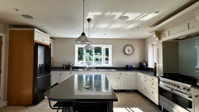 Bespoke Wood Cream Chrome Handled Kitchen with Dove Grey Island including Breakfast Bar – Brittania Smeg Appliances – Dove Grey Stone Worktops