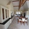 Bespoke Wood Door Buttercream Dovetail Joint Kitchen and Large Island with Breakfast Bar- Bosch Appliances – Black Granite Worktops