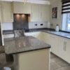 Buttercream Chrome Handled Dovetail Joint Kitchen with Island and Utility Room – Siemens Appliances - Grey Flecked Granite Worktops