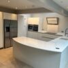 Modern White Handleless Soft Close Kitchen including Peninsula with Breakfast Bar – Neff Siemens Miele Appliances - White Quartz Worktops