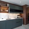 Ex Display Nobilia Easytouch Mineral Green Walnut Riva effect Black Glass Kitchen - Calacatta Gold Quartz 20mm Worktops with Waterfall Sides