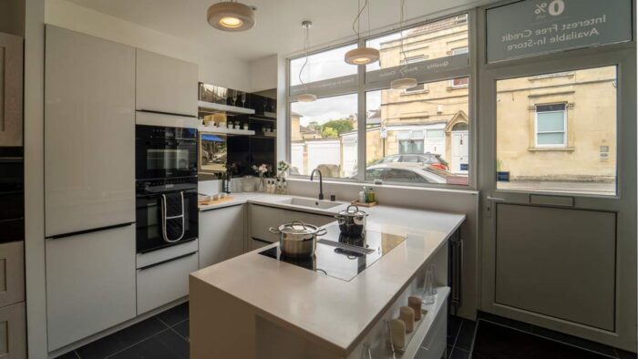 Ex Display Schmidt Glamour White Glass Fronted Kitchen & Peninsular – Miele Appliances - Sparkling White Corian Worktops