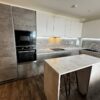 Modern Young Taupe & Ivory Handleless Kitchen with Island – Electrolux Appliances - Laminate Worktops