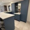 Navy Shaker Style with Gold Handled Bar Area including Antique Mirror including Stainless Steel Champagne Sink - Fugen White Shimmer Quartz Worktops