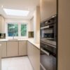 Luxury Poggenpohl Taupe Handleless Kitchen – Miele Siemens Appliances - Quartz Marble Effect Worktops