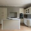 Magnet Buttercream Shaker Kitchen and Matching Island – AEG Elica Appliances – Marble Effect Quartz Worktops