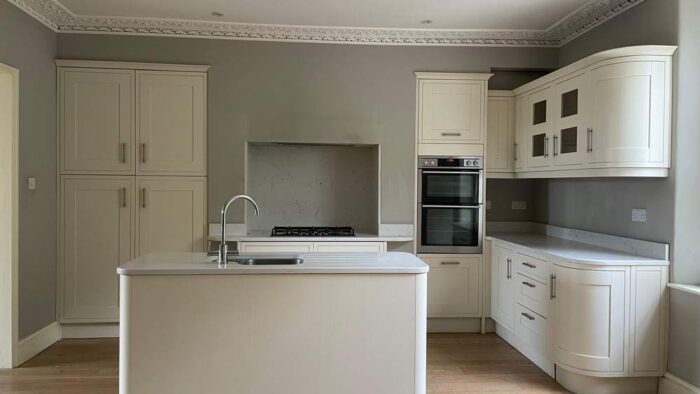 Magnet Buttercream Shaker Kitchen and Matching Island – AEG Elica Appliances – Marble Effect Quartz Worktops