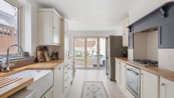 Magnet Buttercream Shaker with Chrome Handled Kitchen - AEG Bosch LG Appliances - Wooden Worktops.