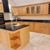 Classic Wood Like Shaker Kitchen with Matching Island – De Dietrich Electrolux Appliances – Black Granite Worktops