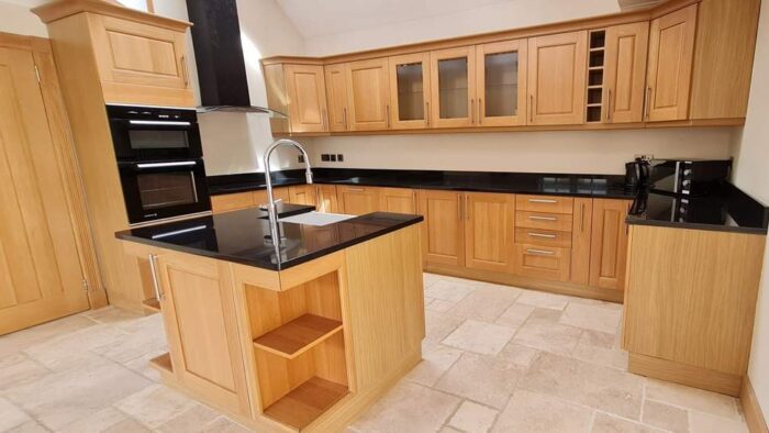 Classic Wood Like Shaker Kitchen with Matching Island – De Dietrich Electrolux Appliances – Black Granite Worktops