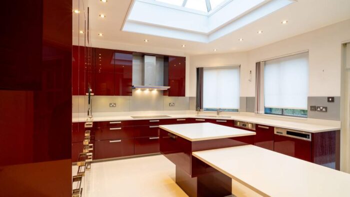 Modern Large Ruby Red Gloss Chrome Handled Kitchen with Peninsula - Miele Appliances – Quartz Worktops