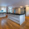 Bespoke Buttercream with Chrome Handled Kitchen inc Matching Large Island with Breakfast Bar – Gaggenau Neff Zip Appliances – Granite Worktops