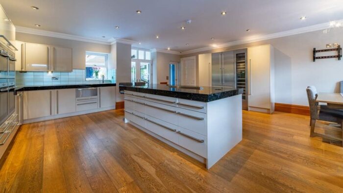 Bespoke Buttercream with Chrome Handled Kitchen inc Matching Large Island with Breakfast Bar – Gaggenau Neff Zip Appliances – Granite Worktops