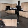 Bespoke Heron Wood Like Shaker Kitchen including Large Peninsula with Breakfast Bar – Rangemaster NEFF Appliances – Black Granite Worktops