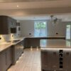 Optiplan Graphite Grey and Ivory Shaker Kitchen including Matching Large Island with Breakfast Bar – Bosch Caple Appliance - Quartz Worktops