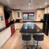 Buttercream Shaker Kitchen inc Matching Island and Breakfast Bar – Belling Caple Indesit Appliances – Black Granite Worktops – 3832849