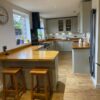 Howdens Olive Green Shaker Kitchen inc Peninsula with Breakfast Bar – Rangemaster CDA Appliances – Wooden Worktops