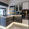 Ex Display Nobilia Touch Nero Oak & Alpine White Kitchen with Breakfast Bar – AEG Blanco Appliances – Krater River Washed Neolith Ceramic Worktops