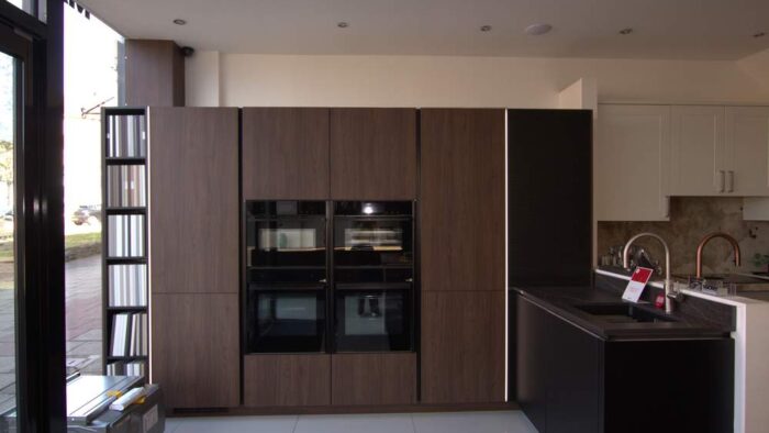 Ex Display Nobilia Walnut Look and Black Matt Handleless Kitchen – Bosch Neff Blanco Appliances - Dekton Luarent 20mm Worktops