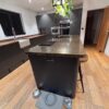 Howdens Graphite Grey Gloss J Handled Kitchen and Island – Lamona Hotpoint Appliances – Wooden & Copper Worktops