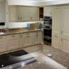 Stoneham Shaker Buttercream Kitchen with Large Peninsula – Neff Miele Quooker Appliances – Marble Effect Granite Worktops