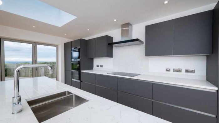 Young Modern Graphite Soft Close Kitchen with Large Matching Island –White Quartz 30mm Worktops