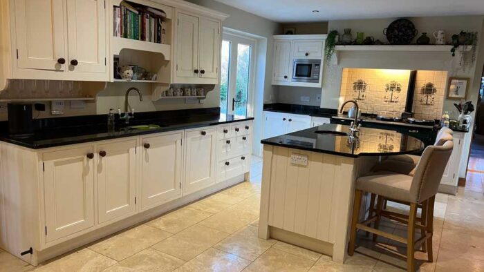 Bespoke Buttercream Dovetail Joint Kitchen with Matching Island and Semi Circle Bench Seating – Granite Worktops