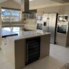 Commodore Dove Grey Chrome Handled Kitchen including Matching Island with Breakfast Bar – Neff AEG Indesit Appliances – Quartz Worktops