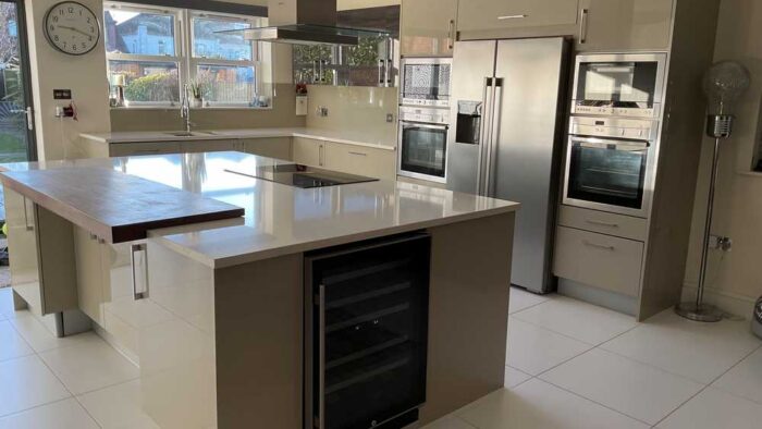 Commodore Dove Grey Chrome Handled Kitchen including Matching Island with Breakfast Bar – Neff AEG Indesit Appliances – Quartz Worktops