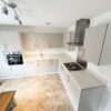 Young Symphony Urban Pebble Soft Closing Stone Grey Kitchen – Zanussi Franke Appliances – Alaska Finish laminate Worktops