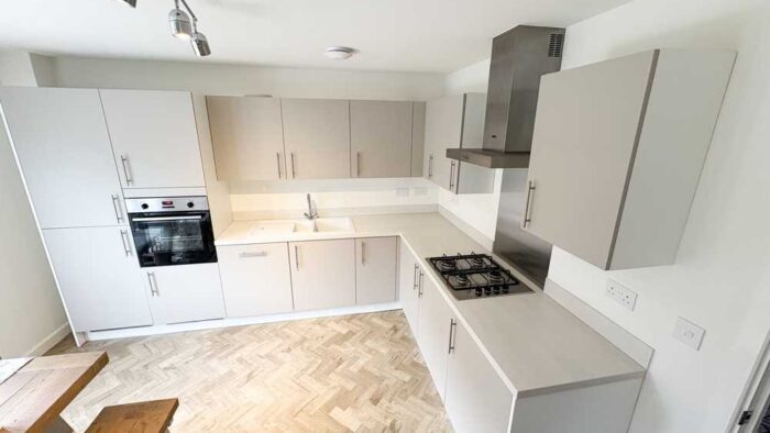 Young Symphony Urban Pebble Soft Closing Stone Grey Kitchen – Zanussi Franke Appliances – Alaska Finish laminate Worktops