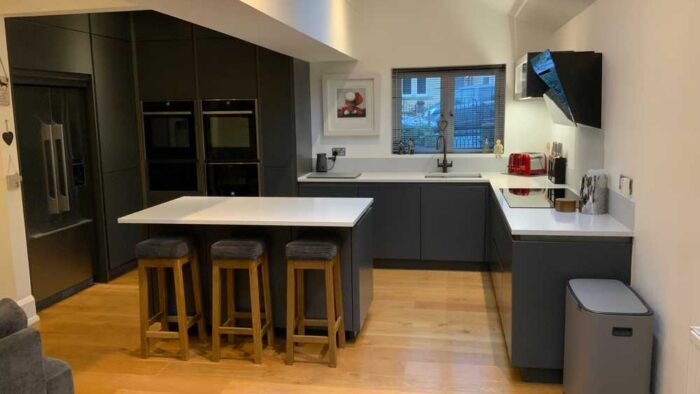 Bespoke John Lewis Moderna Handleless Diamond Grey Kitchen and Matching Island with Breakfast Bar – Neff Elica Frankie Appliances - Minerva Quartz Worktops