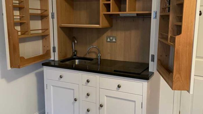 Crafted by Culshaw Bespoke Light Grey Dovetail Joint Kitchenette – Quooker Stellar Ice Q Appliances – Black Granite Worktop