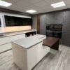 Ex Display Hacker Black Star Stone High Gloss Brilliant White and Cherry Oak Kitchen including Island with Cherry Wood Breakfast Bar – Siemens Appliances – Dekton Grey Gloss Worktops