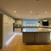 Magnet Stone Grey J Handled Kitchen with Large Matching Island – AEG Neff Beko Appliances – Grey Flecked Quartz Worktops