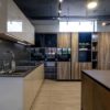 Ex Display Schuller Fino Gloss Kashmir Modena Virginia Oak Effect Kitchen – Siemens Appliances - Silestone Parisien Blue Worktop – 3833033
