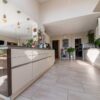 Large Cream Gloss Modern Slab Kitchen with Peninsula and Utility Room – Siemens Bosch Appliances – Quartz Worktops – 3833042