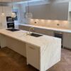Luxury 202 Design Bespoke In Frame Stone Grey Dovetail Joint with Brass Fittings Kitchen and Large Matching Island – Gaggenau Appliance - Calacatta C01 Silk Neolith Porcelain Worktops