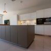 Luxury Bulthaup B3 Cream (Kaolin 15) Modern Slab Kitchen and Island with Breakfast Bar – Gaggenau Quooker Miele Appliances – Composite Stone Worktops (20mm)