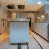 Luxury Bulthaup B3 White Kitchen with Pocket Doors including Large Matching Island with Breakfast Bar- Quooker Appliance – White Quartz Worktops