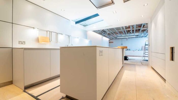 Luxury Bulthaup B3 White Kitchen with Pocket Doors including Large Matching Island with Breakfast Bar- Quooker Appliance – White Quartz Worktops – 3833041