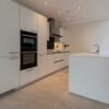 Luxury Unused SieMatic Modern Slab Matt White Kitchen and Large Peninsula – Neff Bosch Appliances – Corian Worktops – 3833039