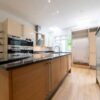 Modern Vanilla with Chrome Handles Kitchen including Island with Breakfast Glass Table – Miele Siemens Appliances – Granite Worktops