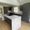 Wren Graphite Grey Modern Slab Soft Close Kitchen and Matching Island with Breakfast Bar – Beko Zanussi Appliances – Laminate Worktops