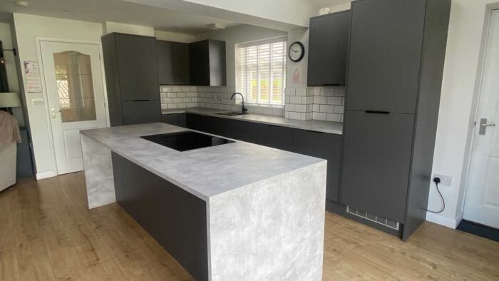 Wren Graphite Grey Modern Slab Soft Close Kitchen and Matching Island with Breakfast Bar – Beko Zanussi Appliances – Laminate Worktops
